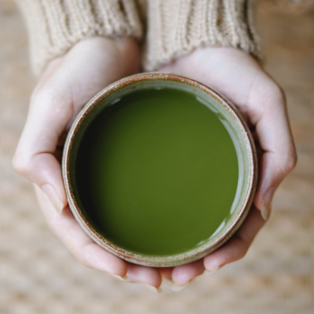 A bowl of black sesame dessert mixed with matcha