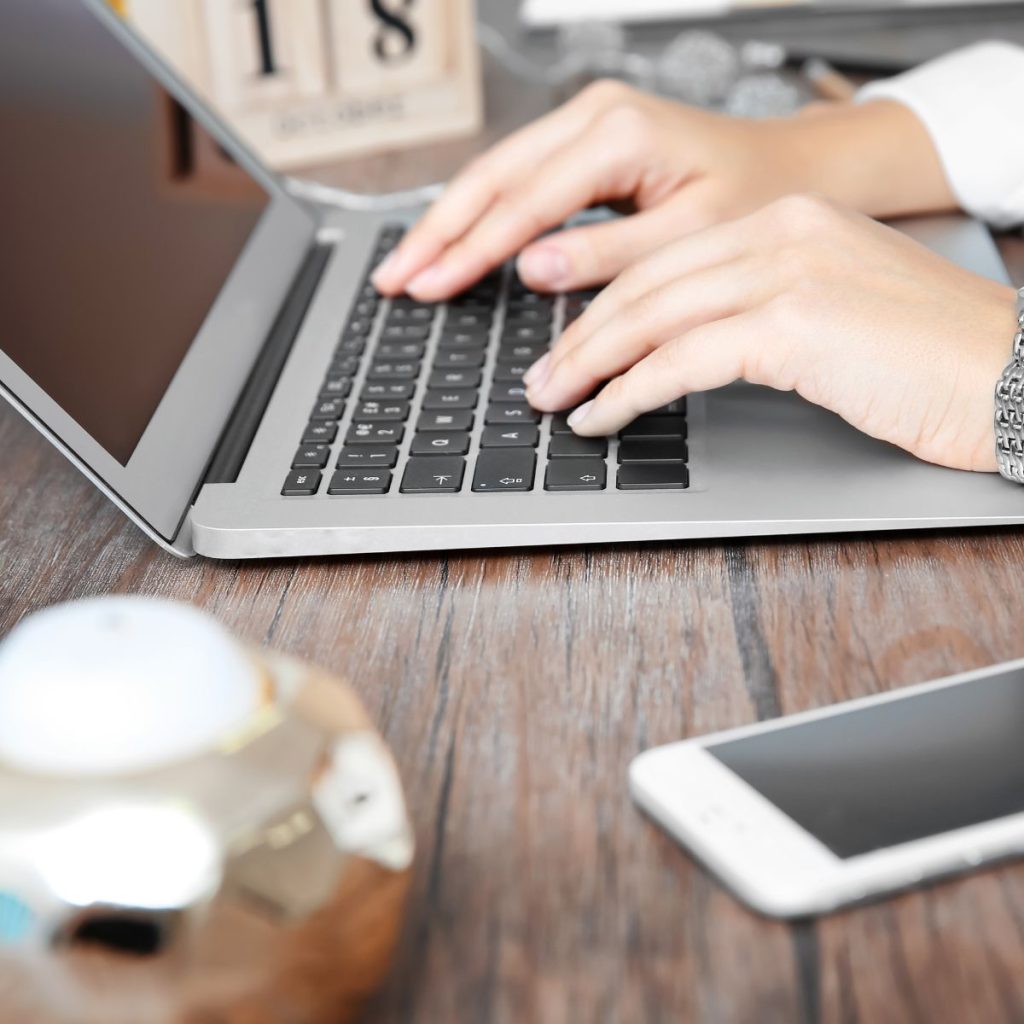 A person booking on a laptop