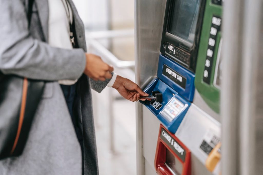 a person using an ATM machine