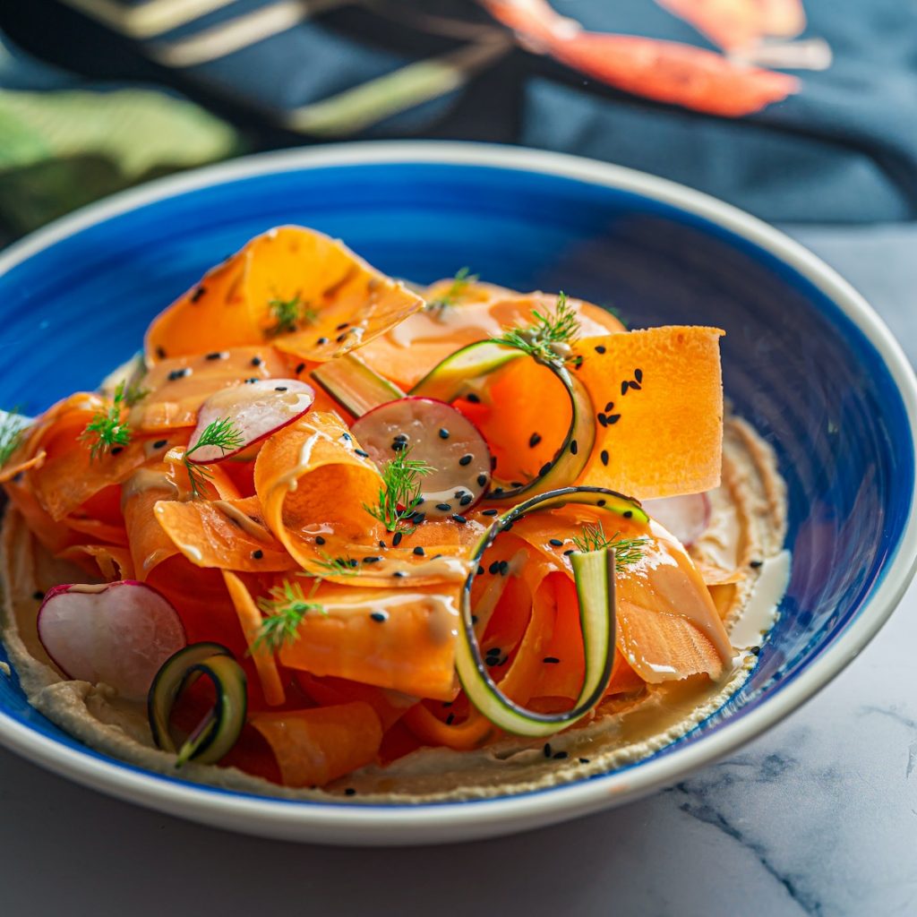 Carrot and radish salad sprinkled with black sesame