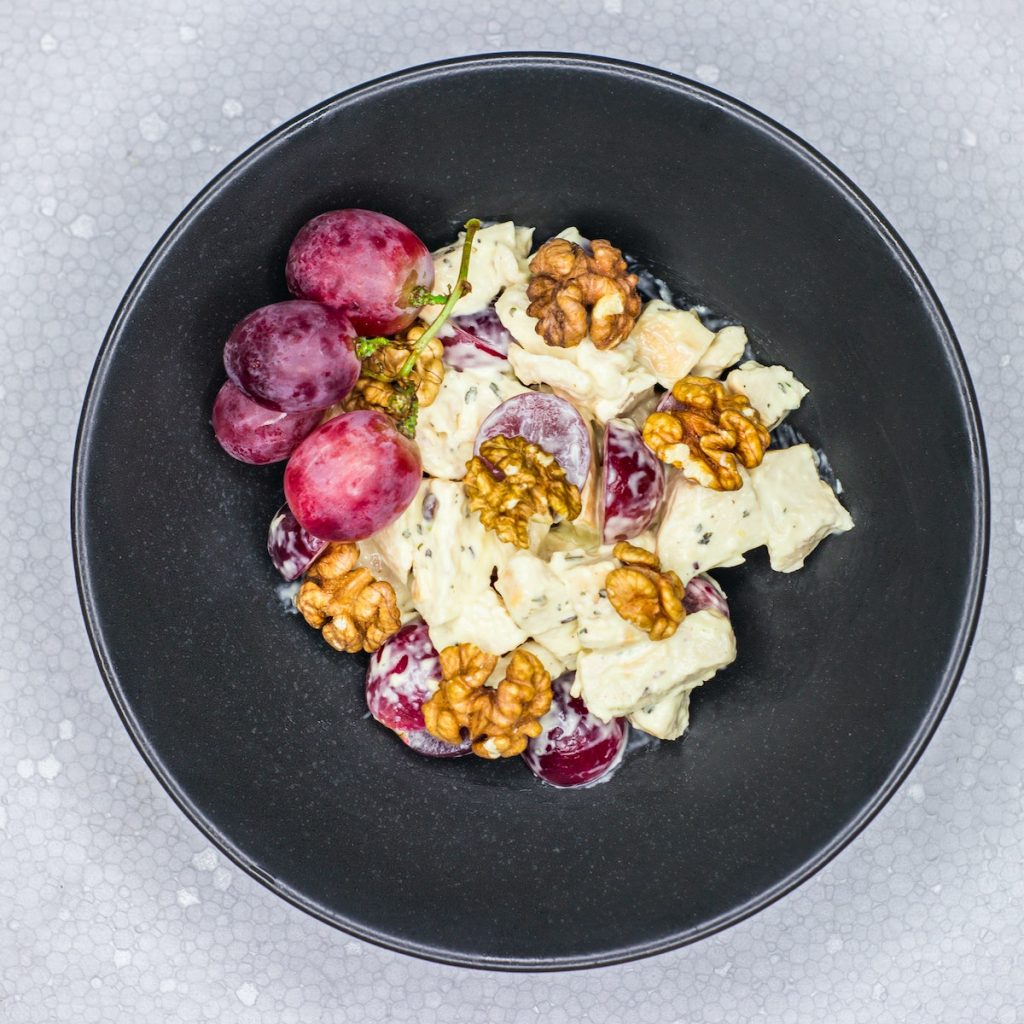 Fruit salad in a bowl with vanilla extract