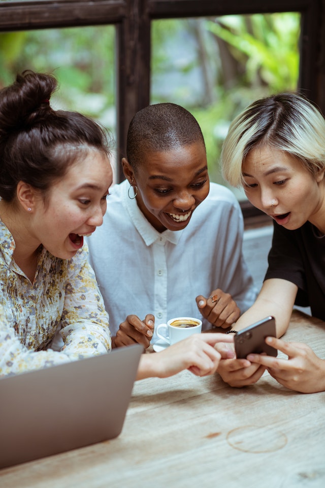 Group of friends looking at the phone