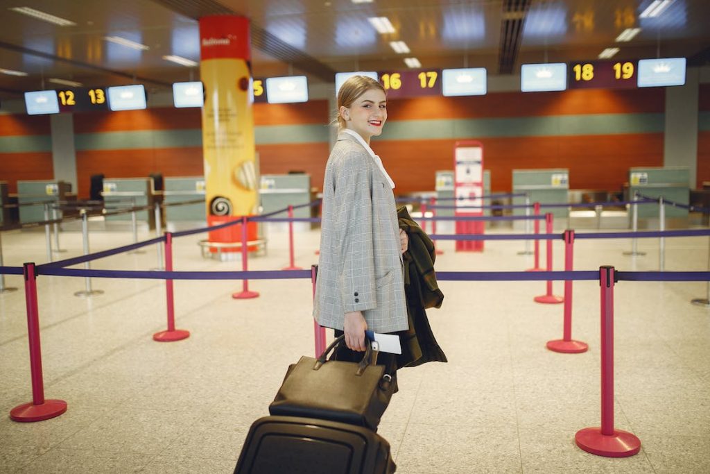 Lady carrying her baggage at the airport