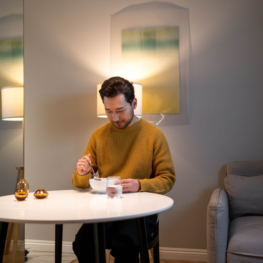 Man eating black sesame dessert