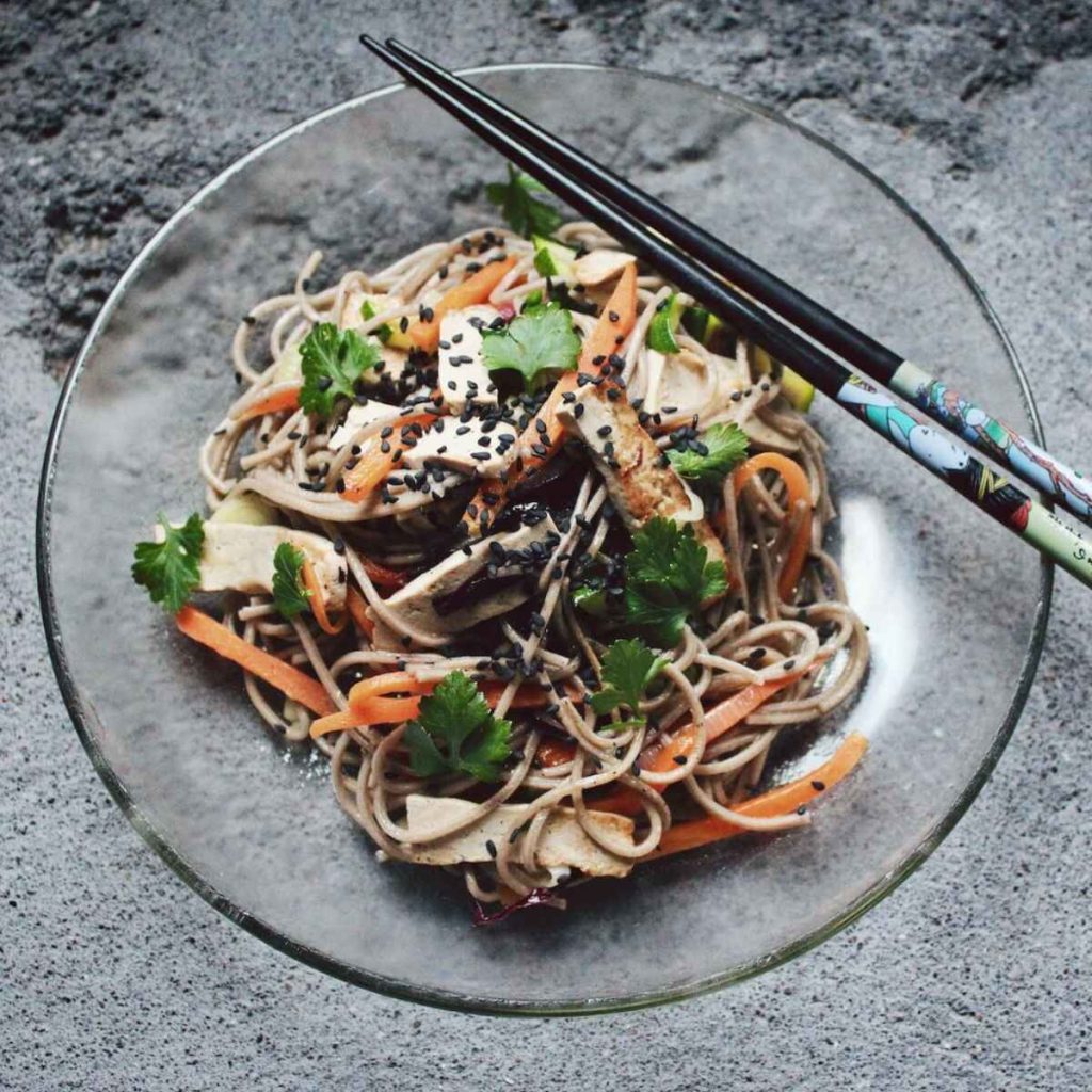 Noodles in a bowl with black sesame seeds