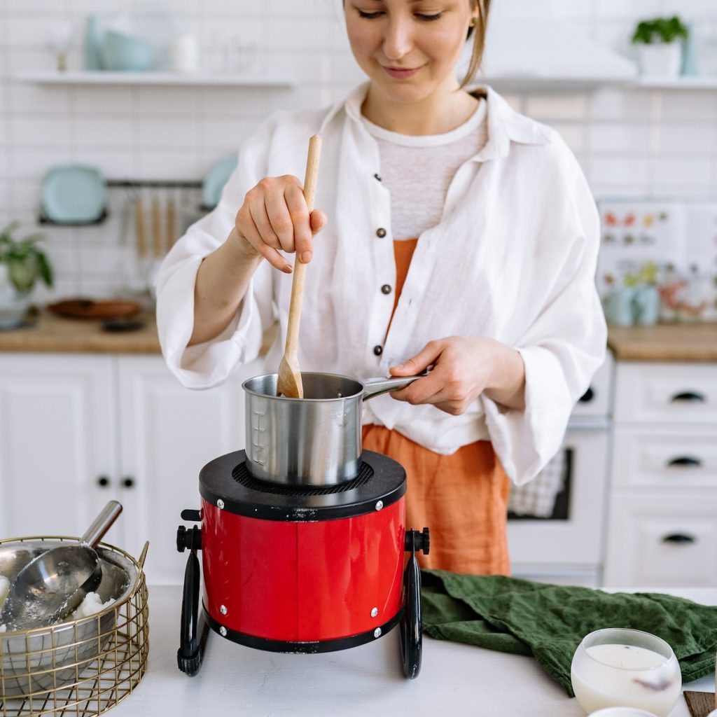 Woman using a wooden spoon in cooking