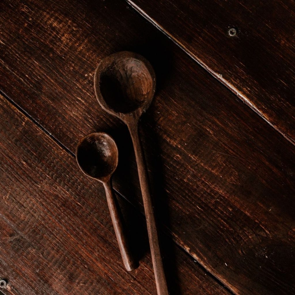 Wooden spoons on wooden table