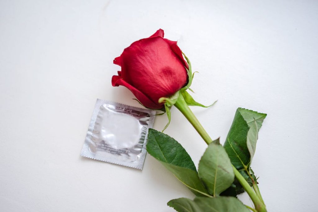 Can I Bring Birth Control to Japan featuring a condom and a rose