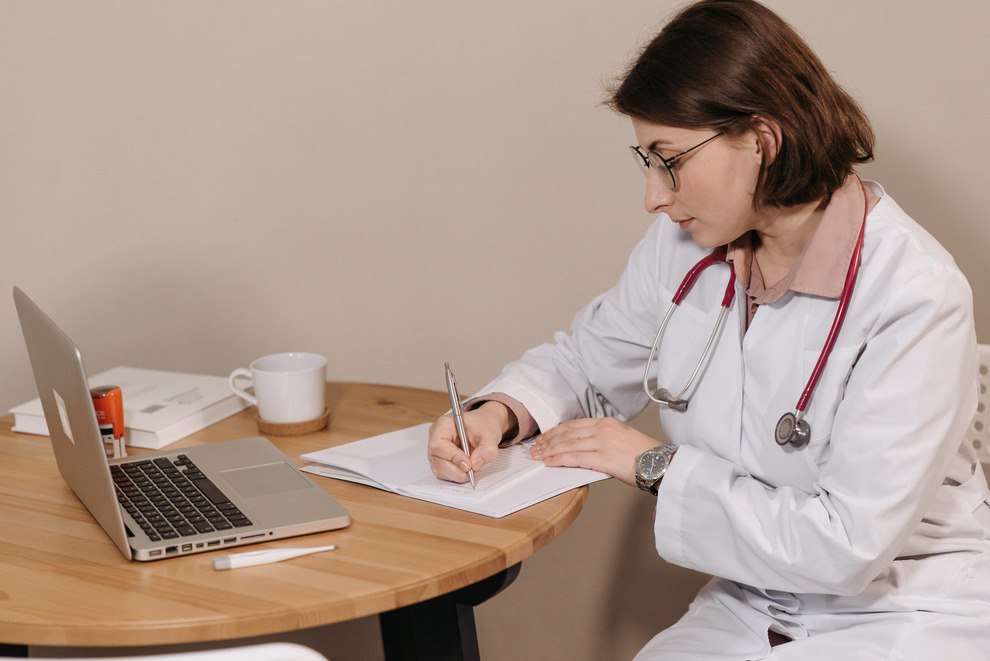 a doctor writing a prescription noted