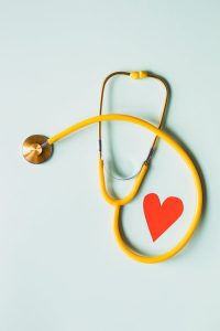 a stetoscope and a heart cutout