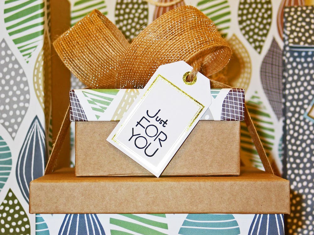 stack of gifts with a 'just for you' note