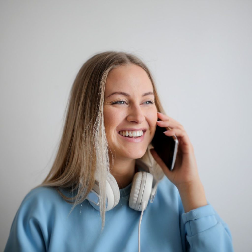 A woman using her phone for calling