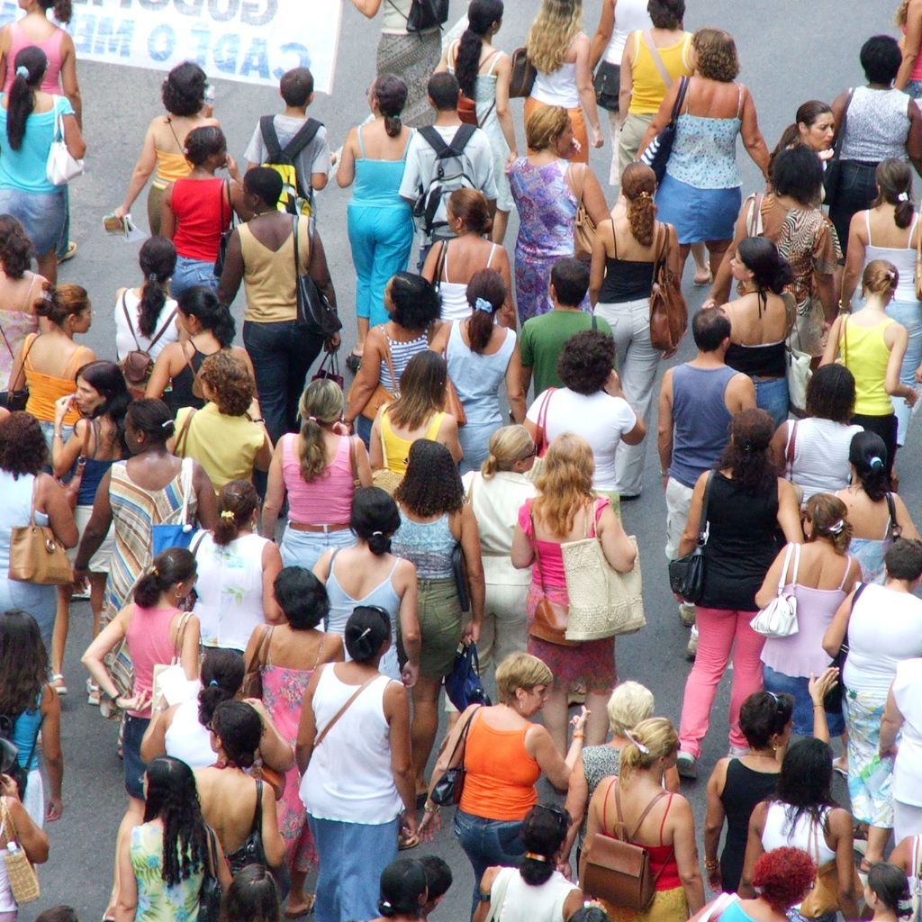 Tripadvisor vs yelp featuring a crowd of people walking on a street