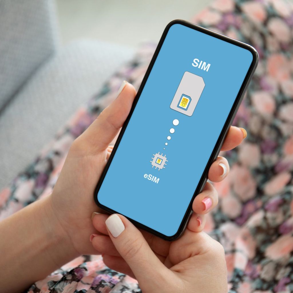 Female hands holding phone with Sim card replacement on eSim