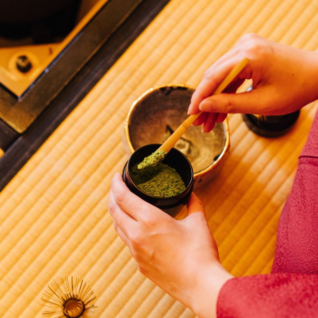 Hands Preparing Matcha Powder for Traditional Tea Ceremony