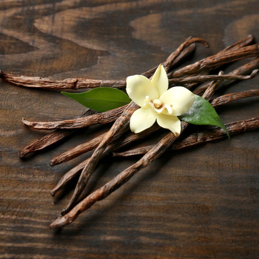 Vanilla beans on a wooden table