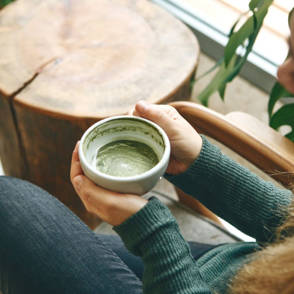 Woman drinking matcha green tea