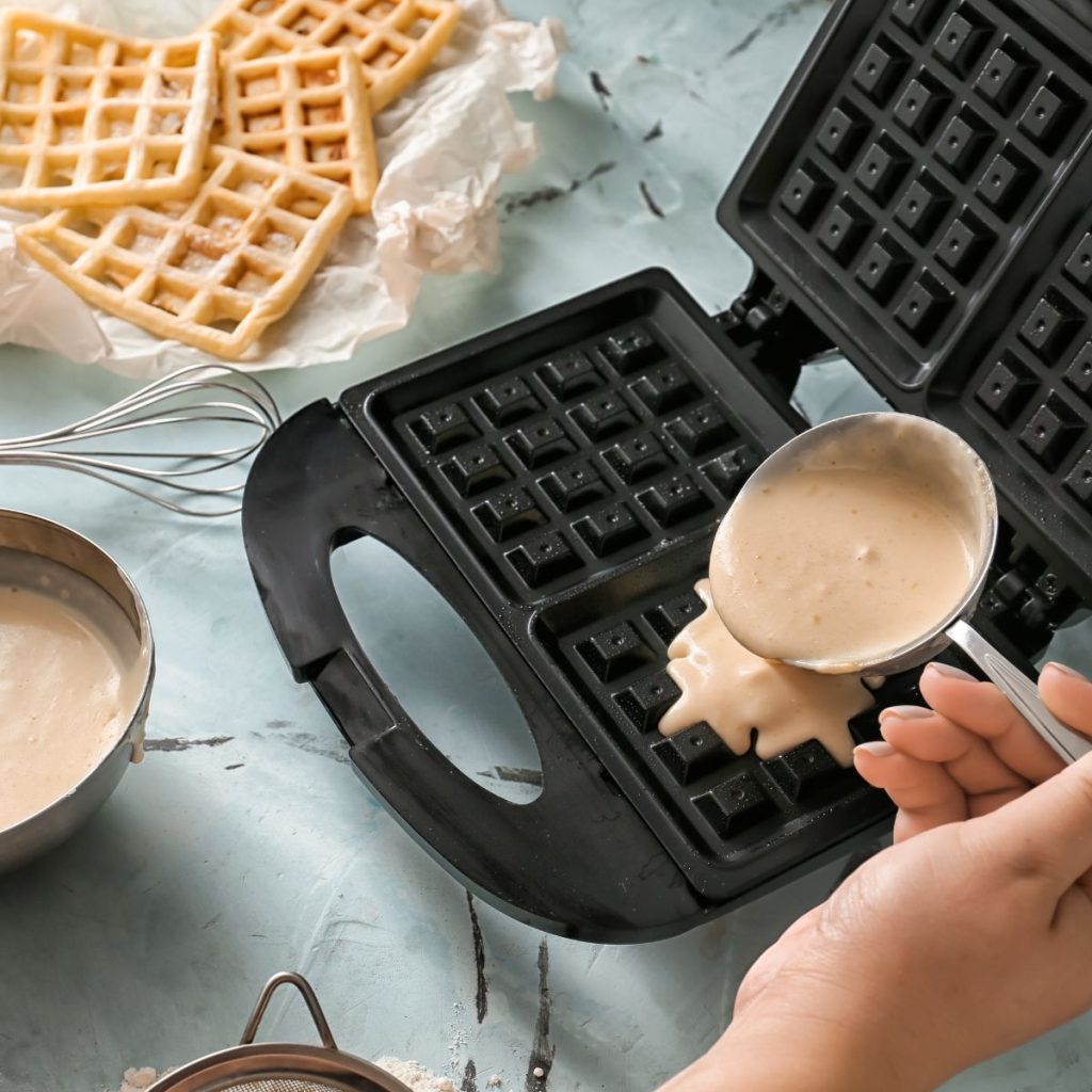 https://alldayieat.com/wp-content/uploads/2023/11/cooking-waffle-in-the-waffle-maker-1024x1024.jpg