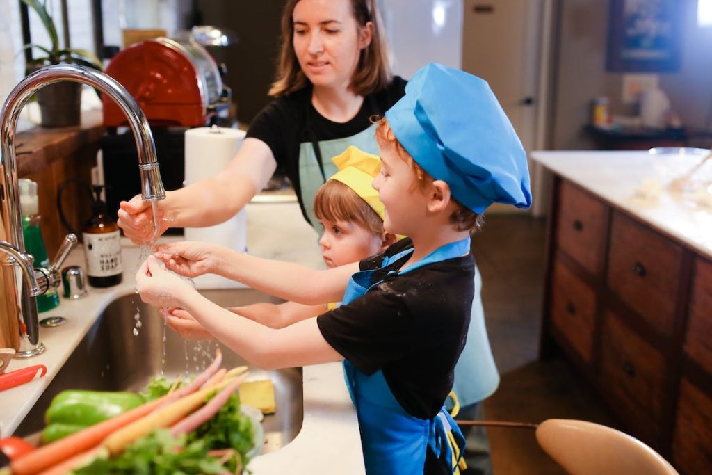 family using a sink