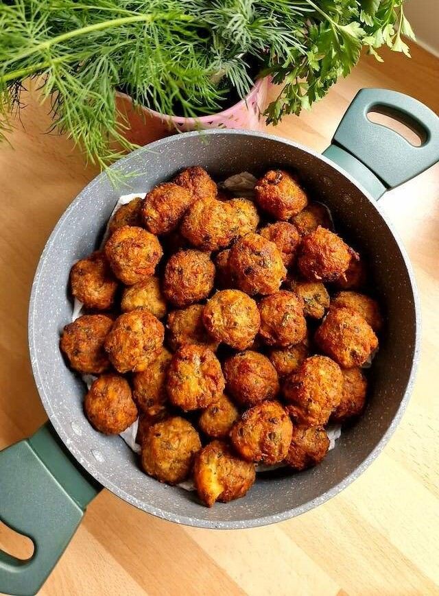 fried meatballs on a black pan