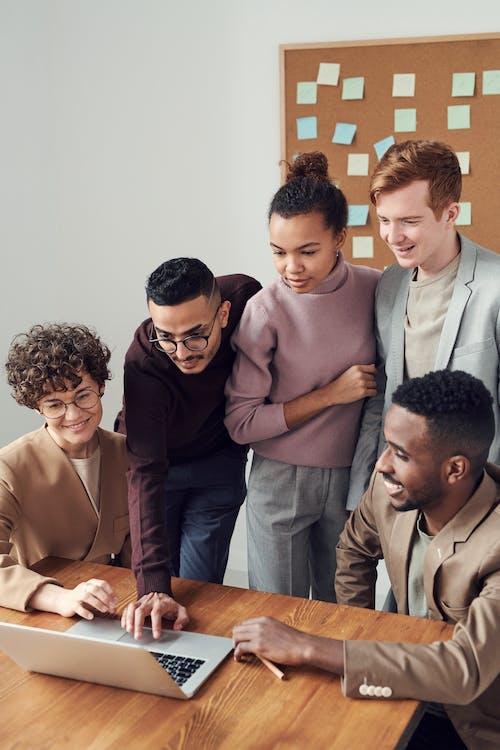 is tripadvisor business free featuring a group of people looking at the laptop screen