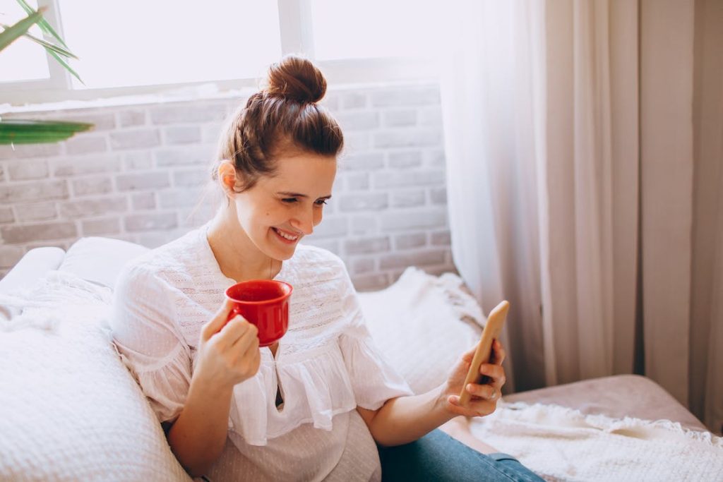 lady smiling browsing a phone