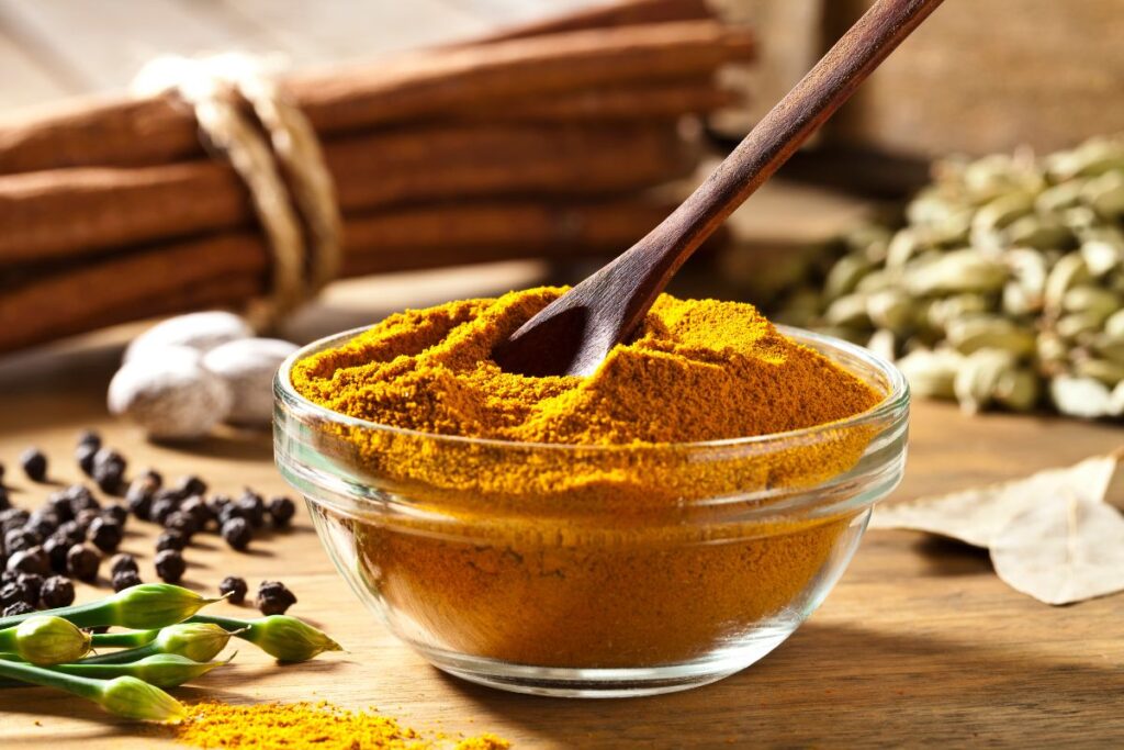 Japanese curry powder being scooped in a bowl