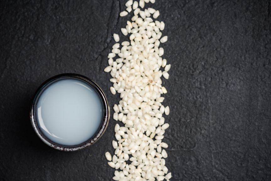 Japanese rice beside a bowl of sake