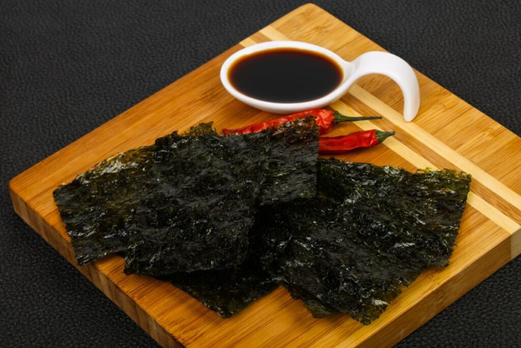 crispy nori sheets on a wooden board