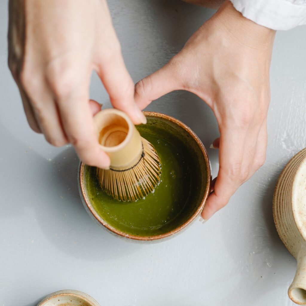 whisking matcha tea