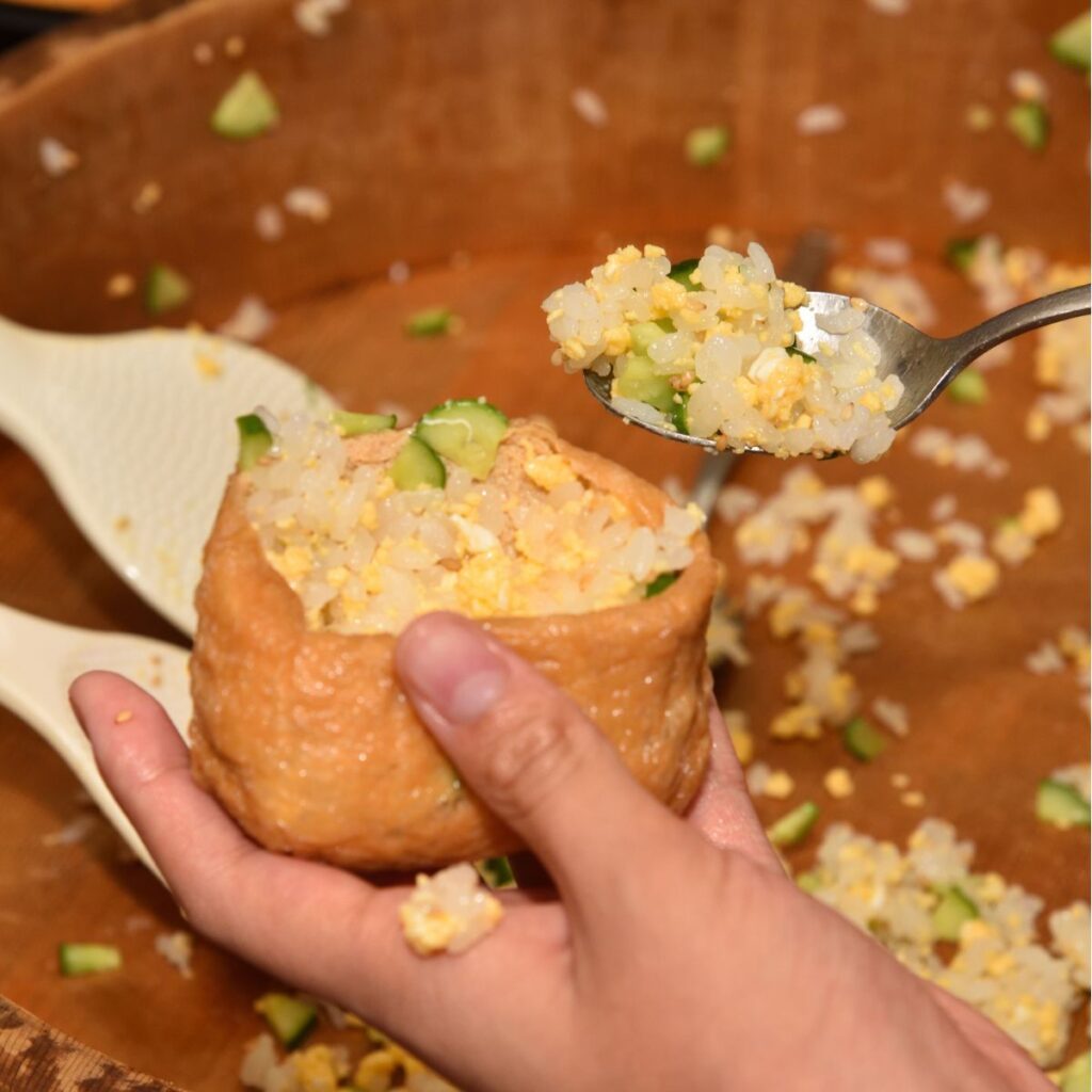 putting rice inside inari